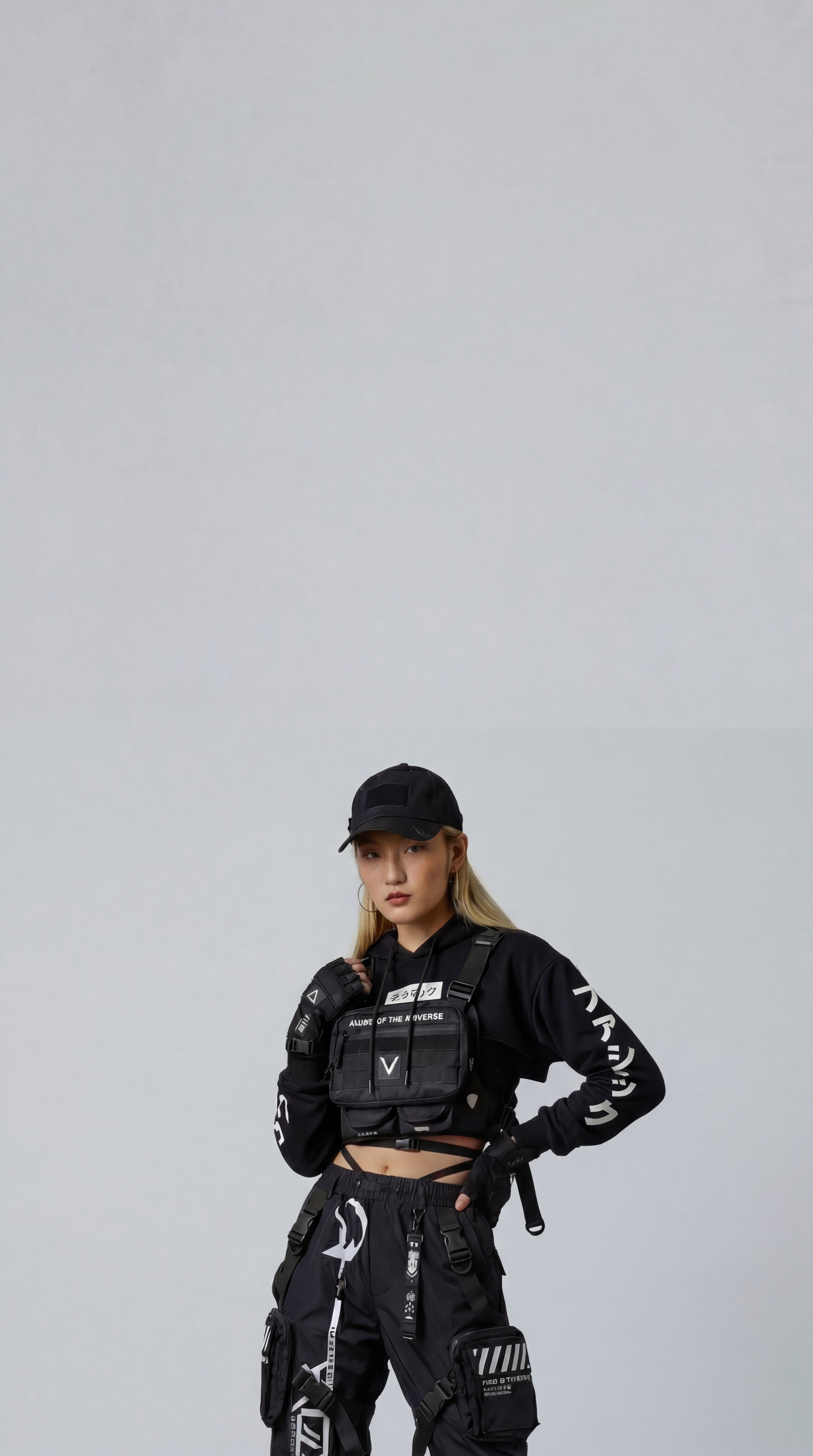 AI generated fashion model who is a asian woman wearing a black techwear outfit.